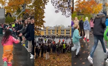 en gruppe mennesker som går på en gate