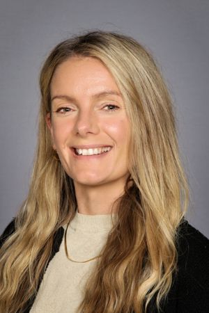 a woman with long hair smiling a woman with long hair smiling